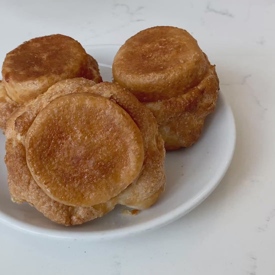 Video of DKA  (Dominique's Kouign Amann) which features a crispy, caramelized crust on the outside with a flaky and tender crumb within
